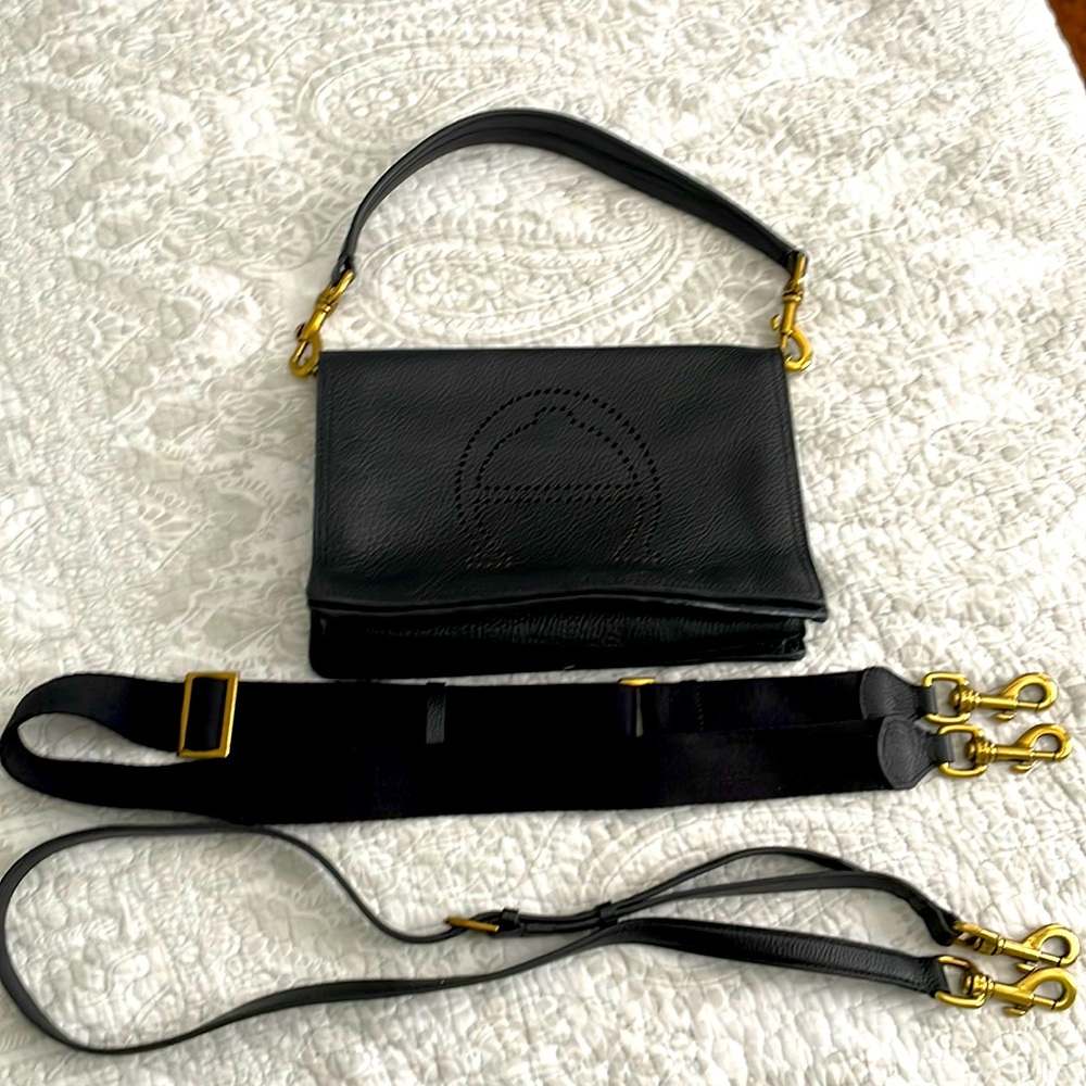 Leather Etienne Aigner purse. Black leather. Gold hardware excellent condition.